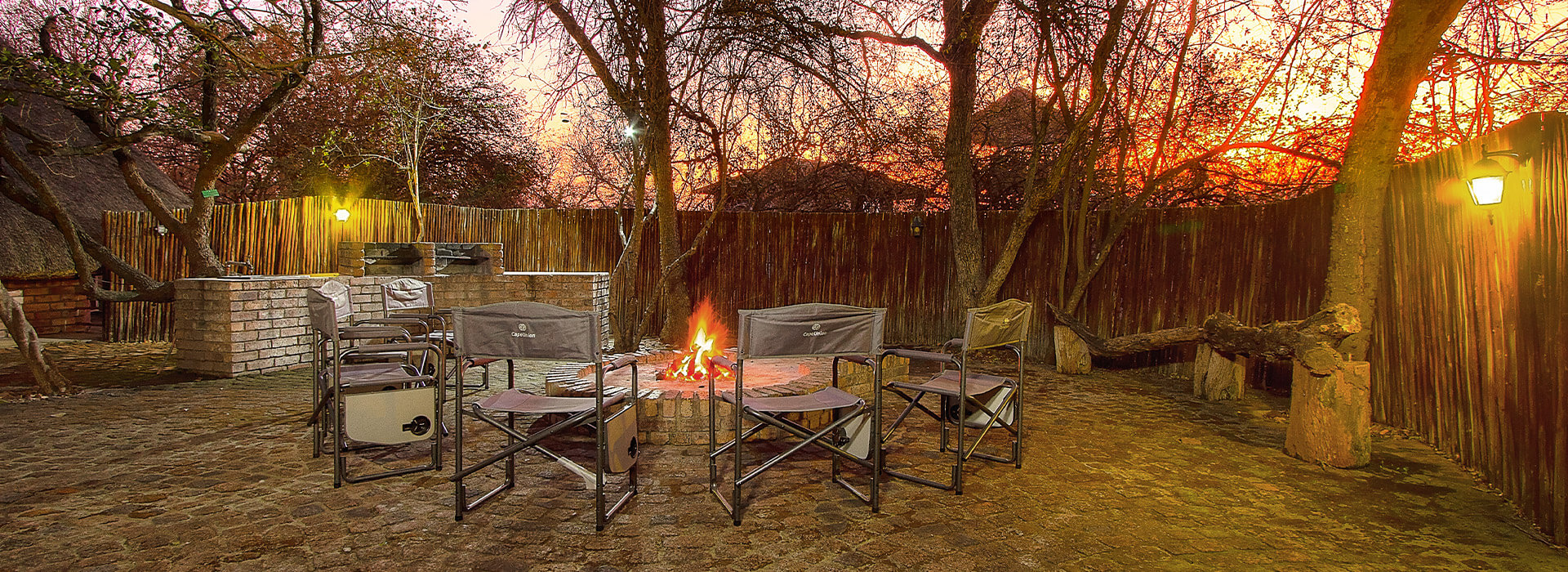 Nyati Safari Bushcamp fire pit and surrounding chairs
